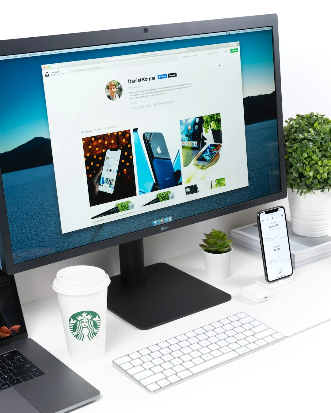 A modern computer screen displaying web design work, showcasing creative visuals in a workspace.